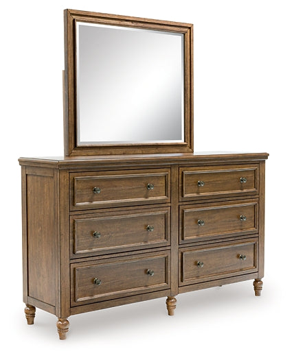 Sturlayne California King Upholstered Panel Bed with Mirrored Dresser and Chest