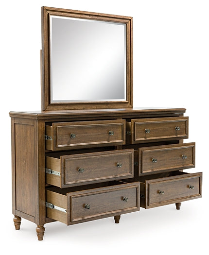 Sturlayne California King Upholstered Panel Bed with Mirrored Dresser and Chest