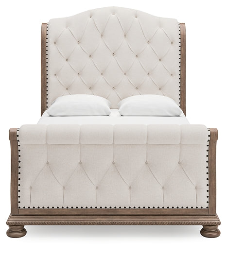 Ardenfield Queen Upholstered Sleigh Bed with Mirrored Dresser and Nightstand